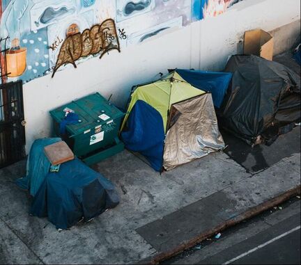 tents of homeless population alongside street