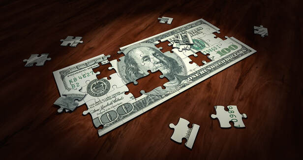 hundred dollar bill photoshopped to look like a puzzle with some pieces outside of it