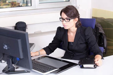 female accountant working at her computer