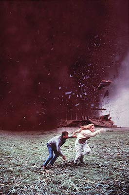 shot from the movie "Twister" with Bill Paxton and Helen Hunt trying to run from storm